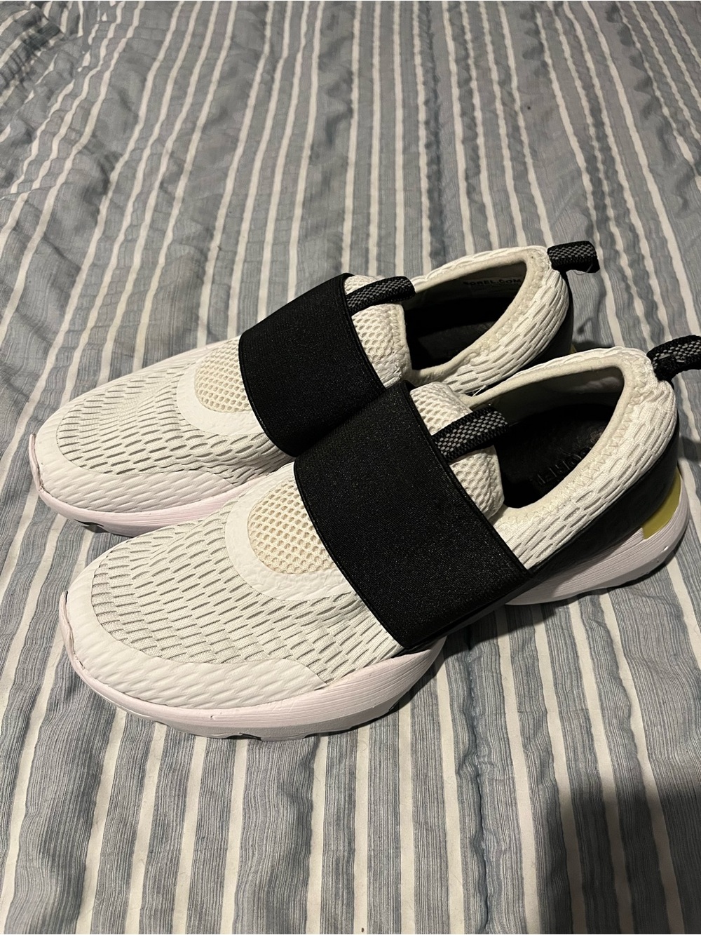 Sorel Women's Slip-On Athletic Sneakers in White and Black with Yellow Accent